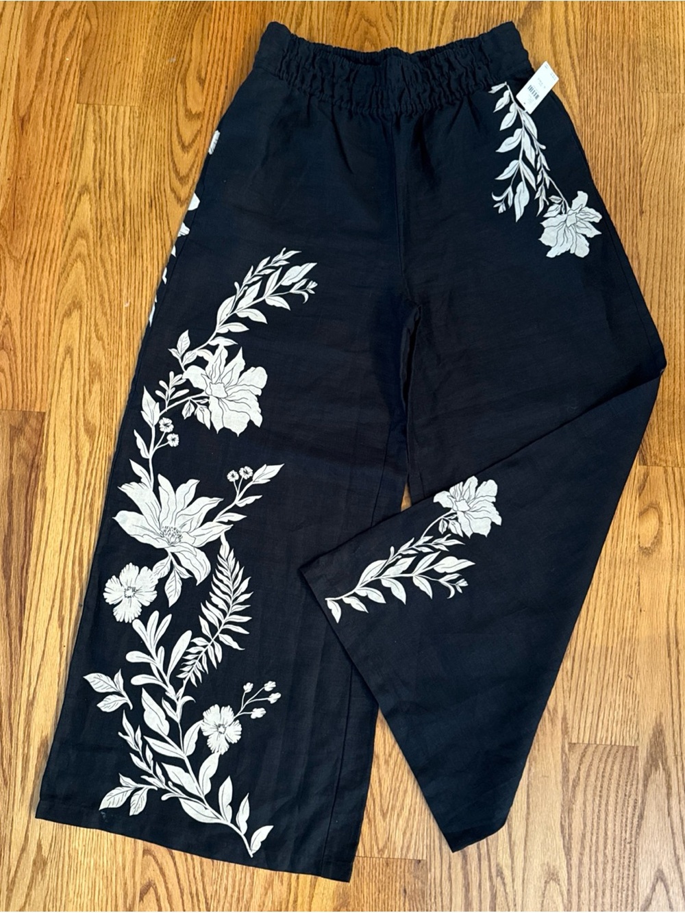 Anthropologie Black Wide-Leg Pants with White Floral Prints